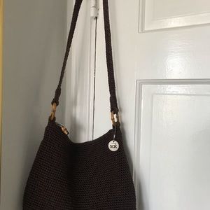 The SAK brown woven bag with bamboo accent